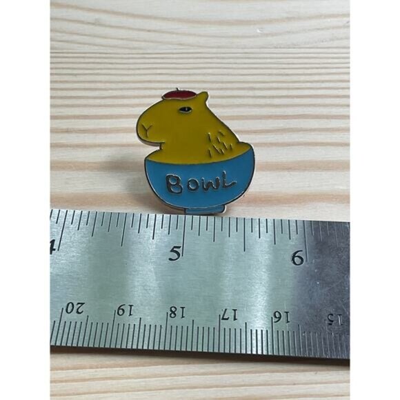 Capybara Enamel Pin With Text "Bowl" In Yellow & Blue Colors - Picture 2 of 3